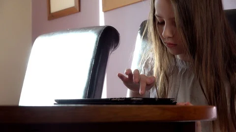 Child uses a tablet Video stock 97448172