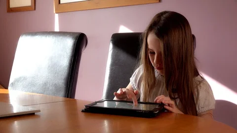 Child uses a tablet Video stock 97448794