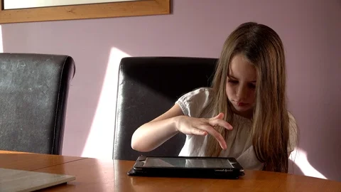 Child uses a tablet Video stock 97449738