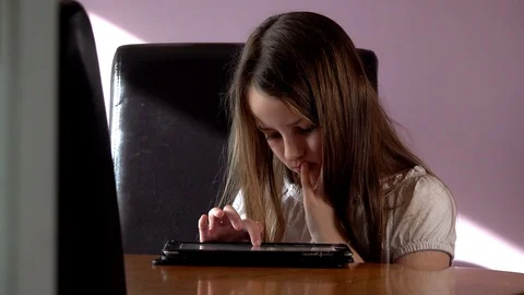 Child uses a tablet Video stock 97450090
