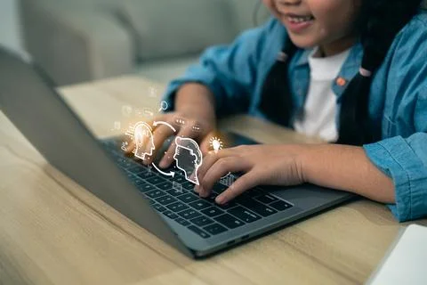 Child using AI technology on laptop for education and future learning. Youn.. 스톡 사진