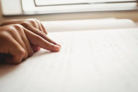 Child using braille to read 스톡 사진