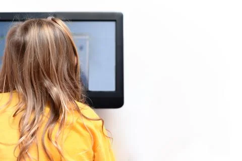 Child using a computer to learn new skills about online learning and to educa Stock Photos