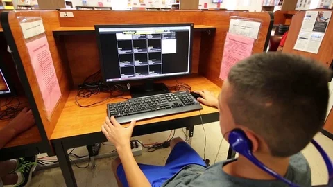 Child using computer at South Texas Residential Family Detention Centre Stock Footage 93544636