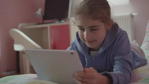 Child Using Digital Tablet Browsing Internet Chat At Home. Girl Watching On.. Stock Footage 302673253