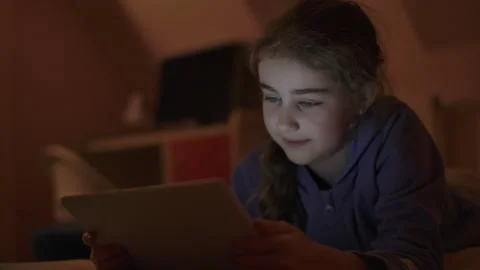 Child Using Digital Tablet Evening at Home. Teen Girl Watching Online Video.. Stock Footage 311062016