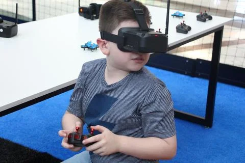 Child Using FPV Goggles to Fly a Mini Drone Stock Photos