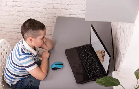 Child using gadgets to study. Education and distance learning for kids Stock-Fotos