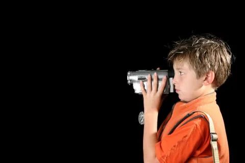 Child using a home video camera Foto stock