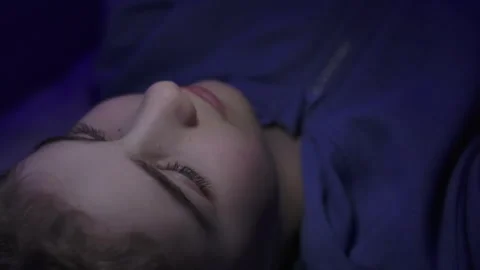 Child Using Mobile Phone Evening at Home. Teen Girl Watching Online Video Stock Footage 282423089