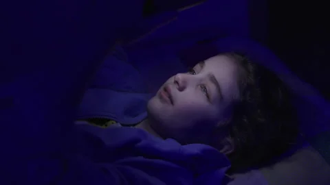 Child Using Mobile Phone Evening at Home. Teen Girl Watching Online Video S.. Stock Footage 345744880