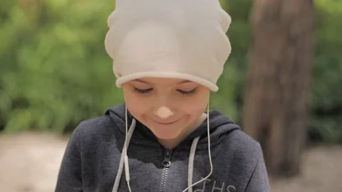 Child is using mobile phone. Kid is looking at screen of devices. Stock-Footage 132997754