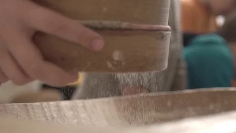 Child using a sieve, slow motion, stock video Stock Footage 85443628