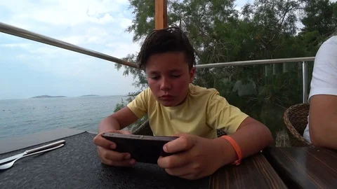 Child using smart phone Stock Footage 76854905