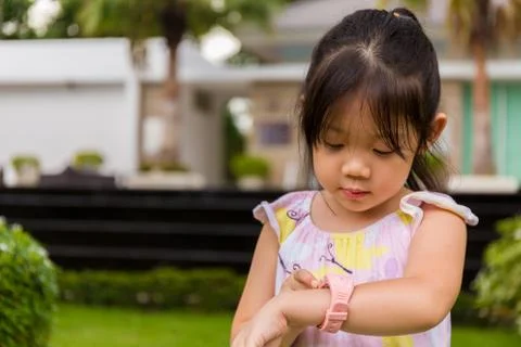 Child Using Smartwatch or Smart Watch / Child with Smartwatch or Smart Watch Stock Photos