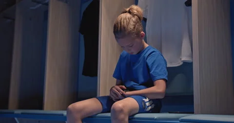 Child using smartwatch on stadium, professional training for kids, young Stock Footage 138893625