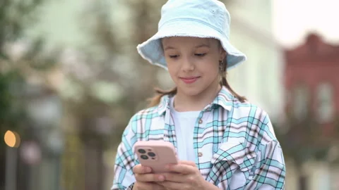 Child using social media application on smartphone or text messages. Stock Footage 245730134