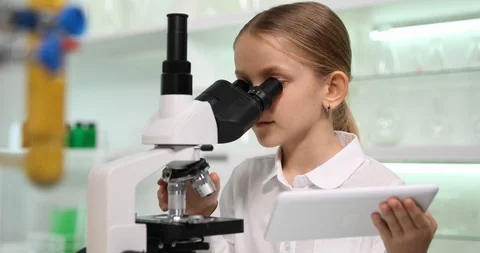 Child Using Tablet, Microscope in School Chemistry Lab, Girl Working Science 4K Stock Footage 87782977