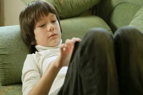 Child Using a Touch Screen Tablet PC At Home Stock Footage