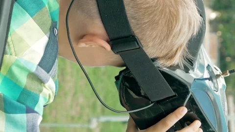 Child using VR glasses to control FPV drone Stock Footage 91143952
