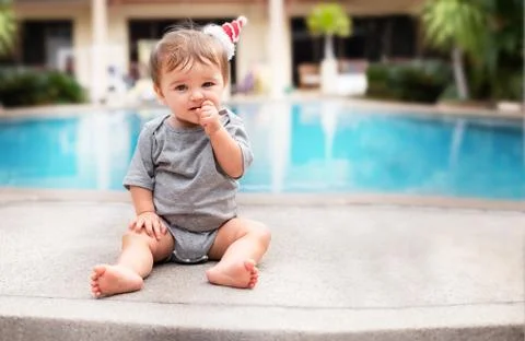 Child on vacation  side of the pool Stock Photos