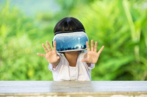 Child with virtual reality goggles. Stock Photos