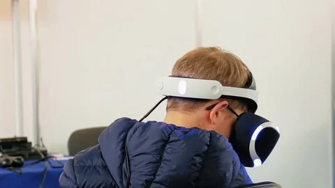 Child in VR headset playing digital virtual game Stock Footage 80098689