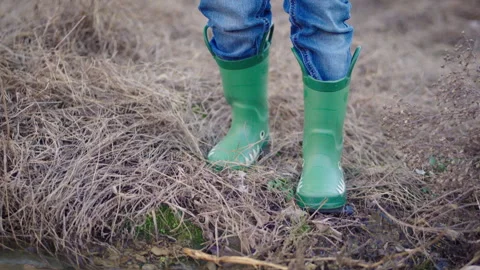 Child Walking In Dry Grass At Edge of Water Stock Footage 300649027