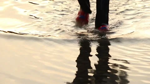 A child walking on a flooded road Stock Footage 220325700