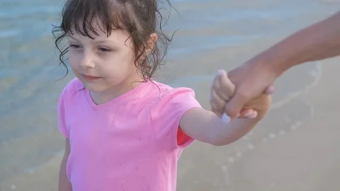 Child walking by the hand with a parent. Stock Footage 111331089