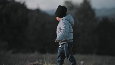 Child walking on hill Stock Footage 254003621
