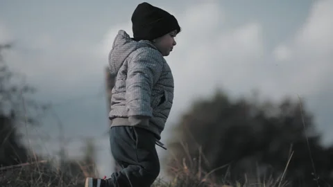 Child walking on hill Stock Footage 254003739