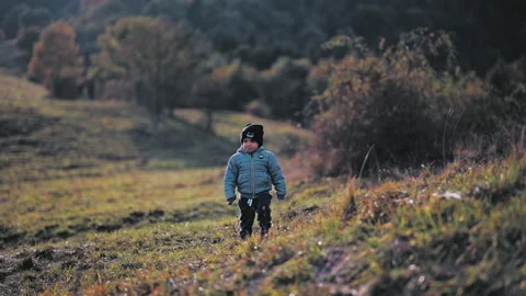Child walking on hill Stock Footage 254004108