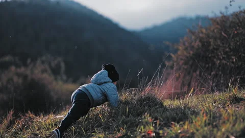Child walking on hill Stock Footage 254004265