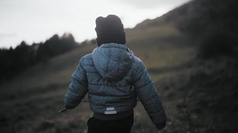 Child walking on hill Stock Footage 254004266
