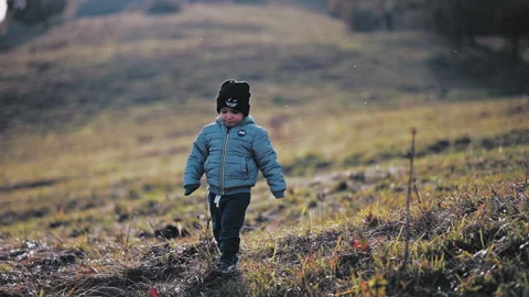 Child walking on hill Stock Footage 254004458