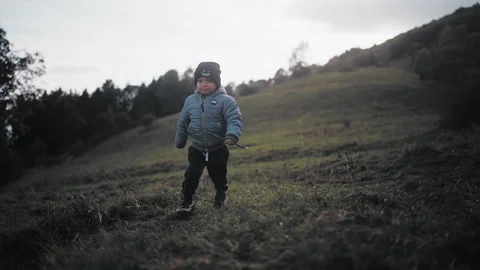 Child walking on hill Stock Footage 254004668