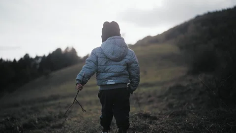 Child walking on hill Stock Footage 254005384