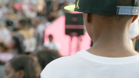 Child walking through a crowd Stock Footage 103818333