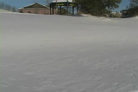 Child walking through the snow Stock Footage