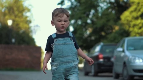 Child walks and expressing disgust Stock Footage 79927050