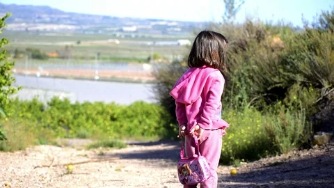 Child walks on a path in the park during travel in the nature. Stock-Footage 126416103