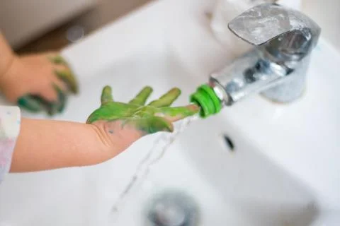 The child washes hands Stock Photos