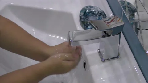 A child washes hands with soap, Hands washing to prevention diffusion of virus Stock Footage 143035465