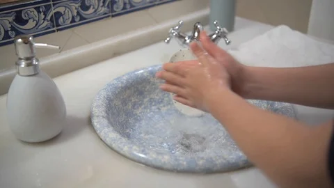 Child washes his hands with soap Stock Footage