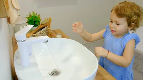 The child washes his hands with soap and water. Selective focus. Stock Footage 237514790