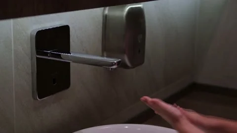 The child washes his hands under the tap. Stock Footage 161869315