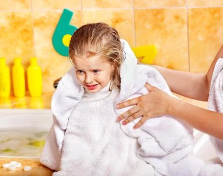 Child washing in bubble bath . Stock Photos