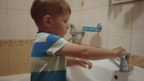 Child is washing face. Stock Footage 76606883