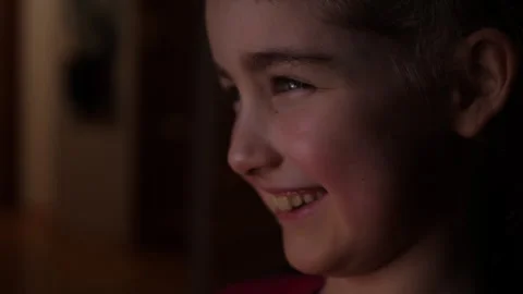 Child Watching Funny Cartoon Comedy on TV and Laughs. Child in Dark is Watc.. Video stock 336022983